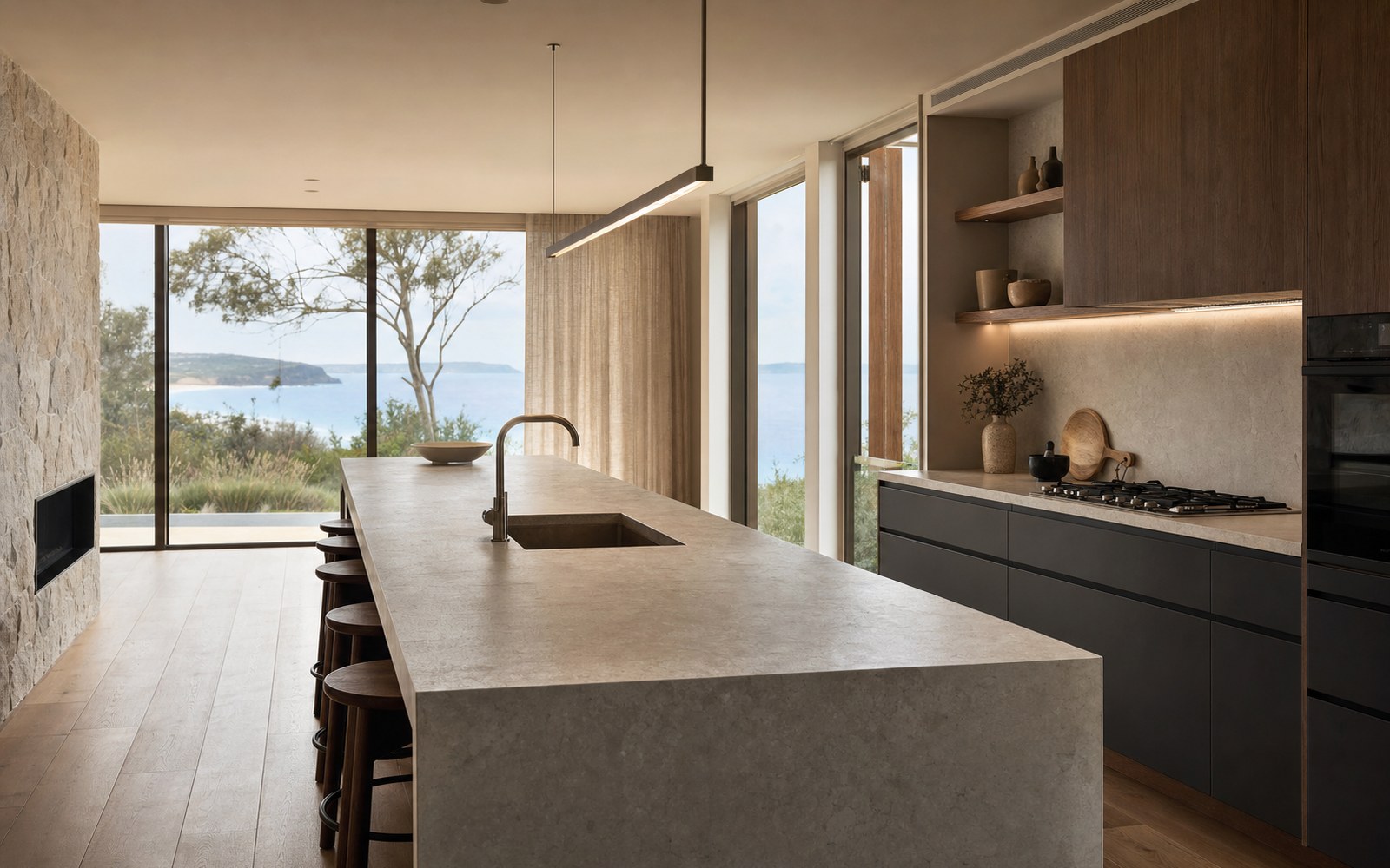 Sintered stone benchtop in a custom kitchen joinery Newcastle NSW — Dekton slab with dark timber cabinetry — feature