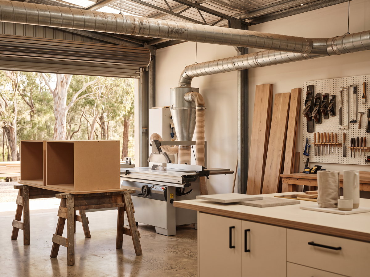 cabinetmaker hourly rate in New South Wales — SteepWood custom joinery Dust extraction equipment beside panel saw in working joinery workshop