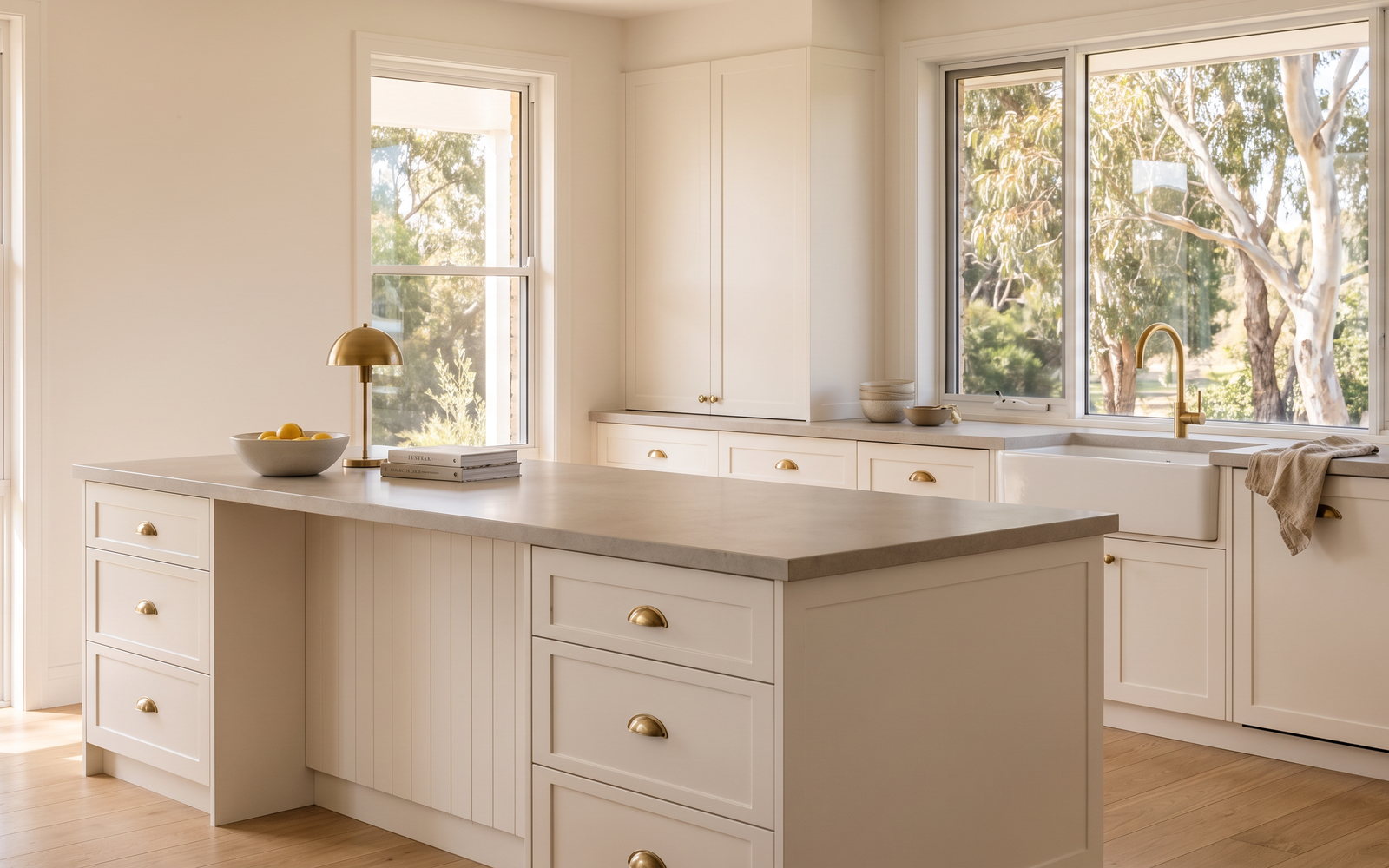 Hamptons kitchen cost in New South Wales — SteepWood custom joinery Painted shaker Hamptons kitchen with porcelain island in a Newcastle family home
