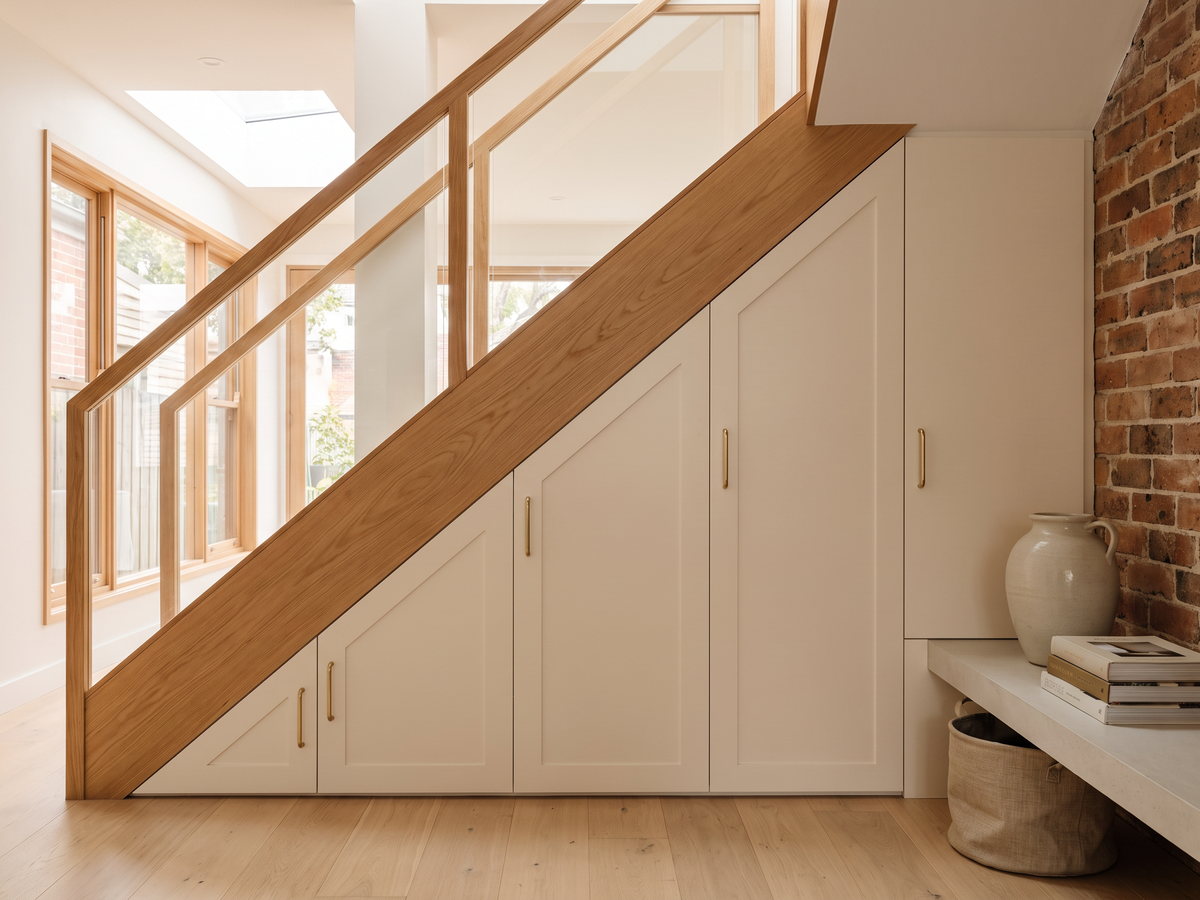 Full-height built-in storage fitted beneath a sloping Federation ceiling