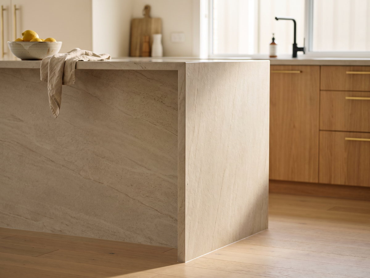 kitchen island cost in New South Wales — SteepWood custom joinery Waterfall porcelain island end installed in a Central Coast kitchen
