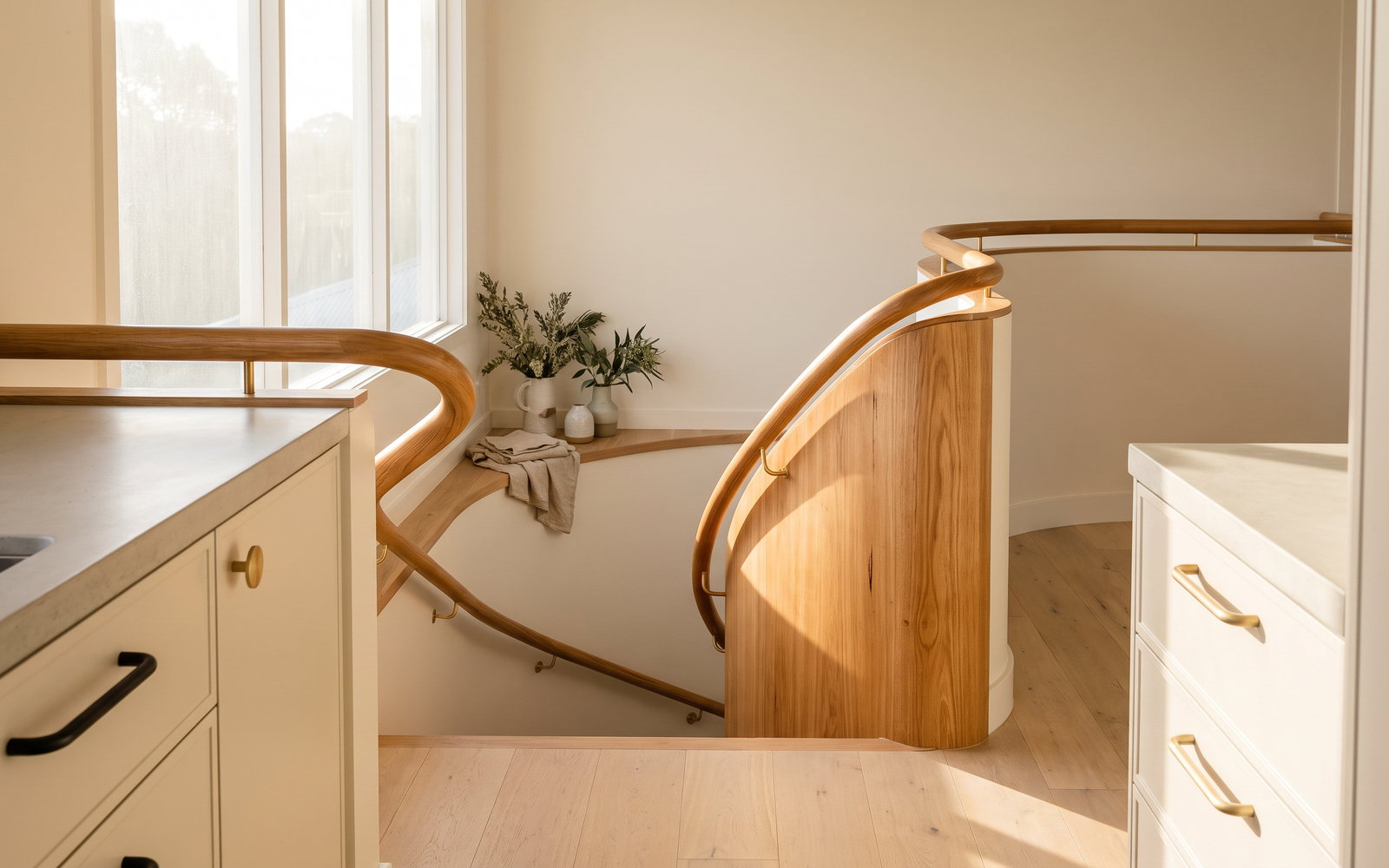 Curved timber handrail fitted to a custom NSW staircase